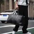 Spot  neutral travel bag, business portable big bag, solid color single shoulder hand-woven bag